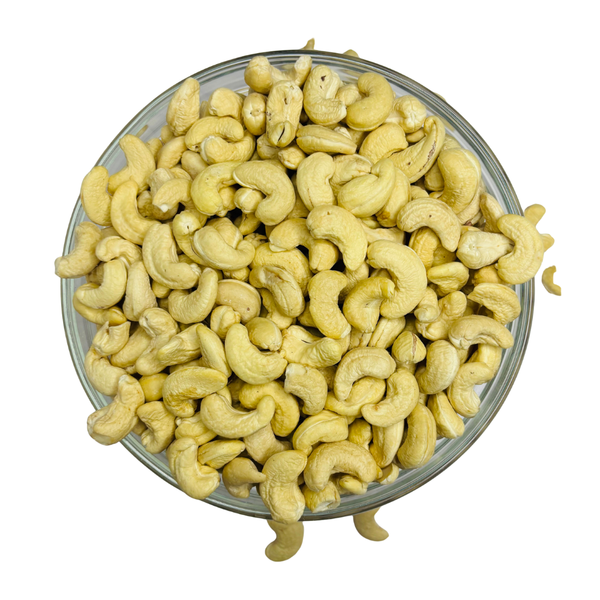 Nuts For Wellness Glass bowl filled with cashews on a white background
