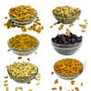 Nuts for wellness Assorted dried fruits and nuts in glass bowls on a white background