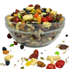 Nuts For Wellness Glass bowl filled with a mix of nuts, seeds, and dried fruits on a white background