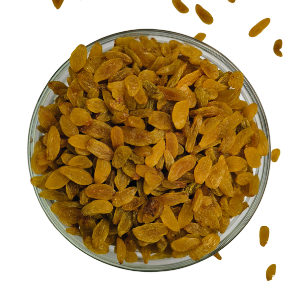 Glass bowl filled with yellow raisins on a white background
