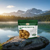 Bag of walnuts on a rock with a scenic mountain and lake background