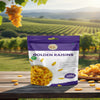 Nuts For Wellness Package of Golden Raisins with a vineyard background
