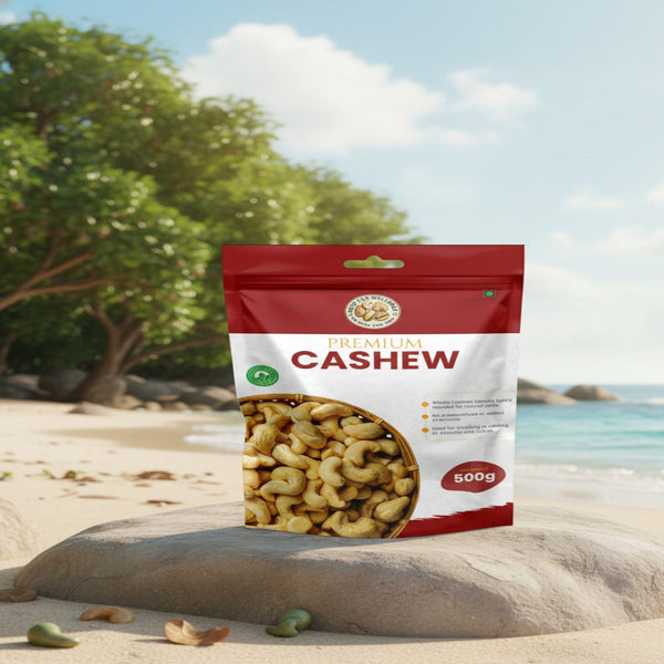 Bag of premium cashews on a beach with trees and ocean in the background