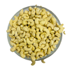 Nuts For Wellness Glass bowl filled with cashews on a white background