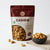 Nuts For Wellness Cashew 100g Bag of premium cashews with a bowl of cashews on a white background
