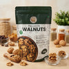 Nuts For Wellness Premium Walnuts 500g Packaging of premium walnuts with a wooden scoop and walnuts on a table.